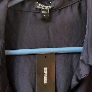 Black silky button down shirt.